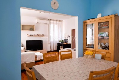 Appartamento confortevole con 2 camere da letto, riscaldamento centralizzato a gas e giardino in uso