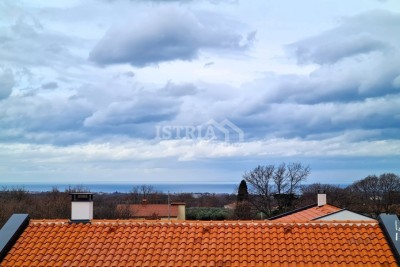 A wonderful new apartment with a roof terrace and a view of the sea