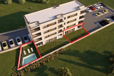 Appartamento con piscina e giardino al piano terra di una nuova palazzina per una piacevole vacanza