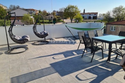 A beautiful apartment with a roof terrace and custom-made furniture