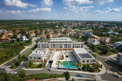 Stan na 1. katu atraktivne nove zgrade udaljene samo 1.000 m od mora