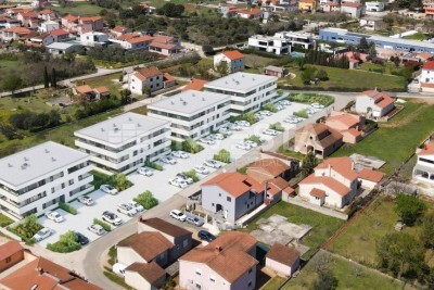 Zona di Pula, appartamento con due camere A5 al piano terra di una nuova costruzione, 2 posti auto