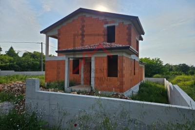 House in the unfinished stage for sale