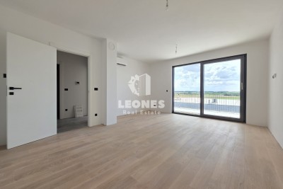 Apartment on the third floor of a quality new building in Umag